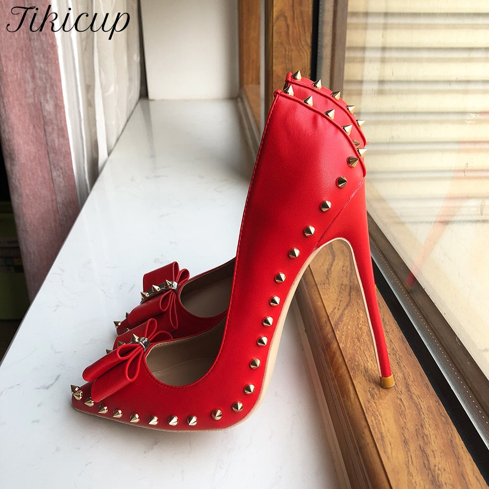 Luxury red pumps with studs and bow detail