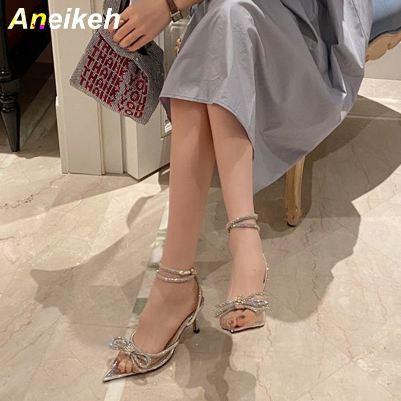Crystal butterfly knot pointed toe pumps