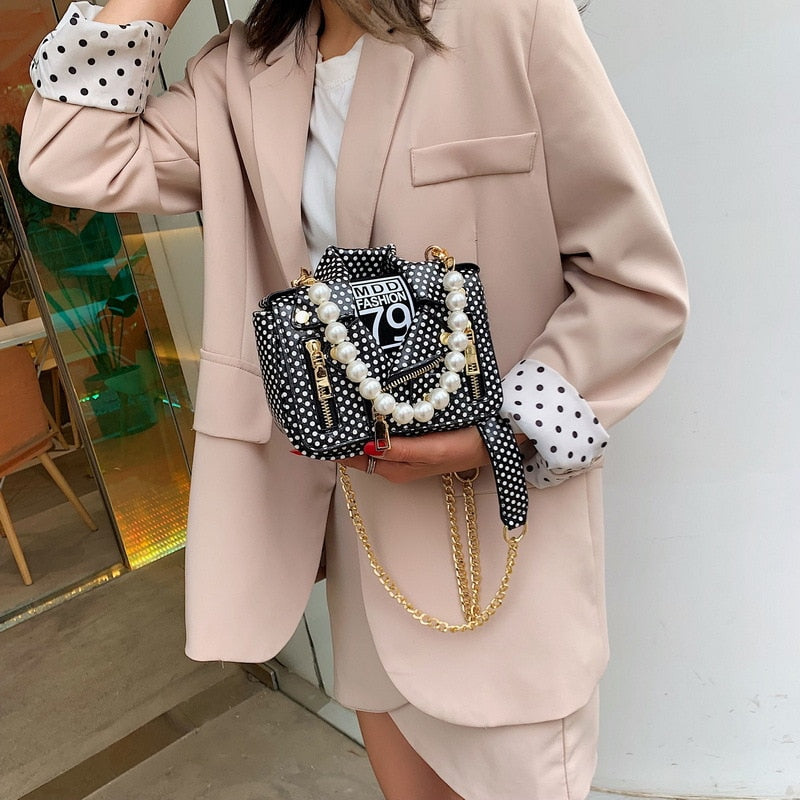 Mini jacket crossbody bag with chain and pearls details