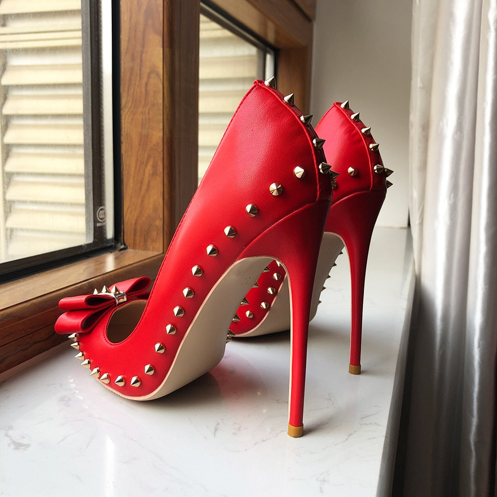 Luxury red pumps with studs and bow detail